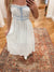 Effortlessly elevate your style with our Calla Blue Midi Dress. Featuring a charming floral bow pattern and ruffle trim, this dress is designed with a square neckline, adjustable spaghetti straps, and an elastic back waist tunnel for a flattering fit. The contrast front tie detail adds a touch of elegance. Boutique style Ashland, Kentucky 