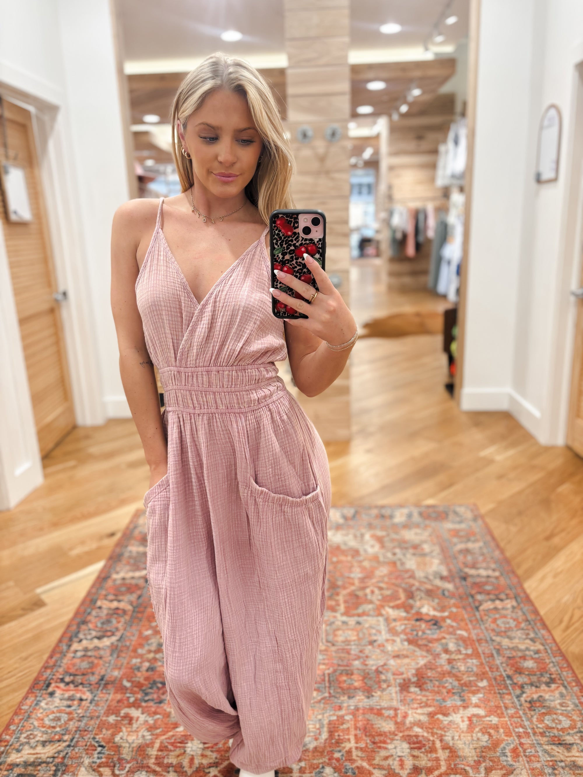 Expertly crafted from mineral washed cotton gauze, the Easy Days Mauve Jumpsuit offers a sophisticated yet casual look. The sleeveless design and adjustable straps provide a comfortable fit, while the deep V-neck and elastic waist add a touch of elegance. With side pockets for added convenience, this jumpsuit is perfect for any easy day. Boutique style Ashland, Kentucky 