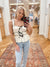 Expertly crafted from lightweight, slightly sheer woven material, the Azura Ivory Top offers a chic yet comfortable addition to any wardrobe. With a square neckline and wide ruched elastic straps, this top also features a front bow detail and contrast detailing for a unique touch. Boutique style Ashland, Kentucky  