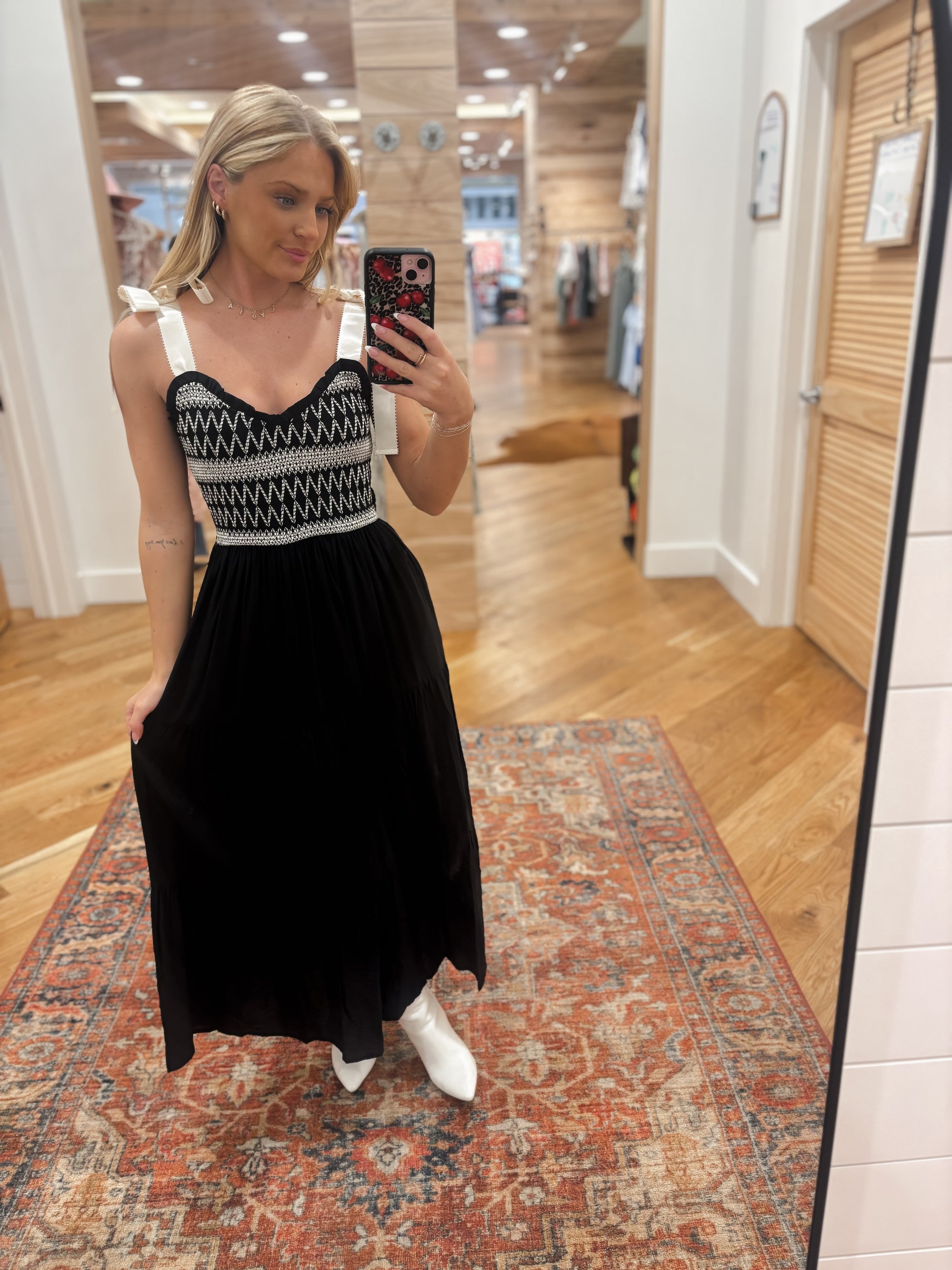 Upgrade your wardrobe with the Tied Intentions Black Maxi Dress! This stunning maxi dress features a flattering sweetheart neckline and sleeveless design, perfect for any occasion. The ribbon tie strap and smocked bodice with embroidery detail add a charming touch, while the contrast detailing adds a pop of style. Made with a soft and lightweight rayon-nylon blend shell and fully lined with 100% polyester, this dress will keep you comfortable and stylish all day long. Boutique style Ashland, Kentucky 
