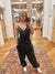 Expertly crafted from mineral washed cotton gauze, the Easy Days Black Jumpsuit offers a sophisticated yet casual look. The sleeveless design and adjustable straps provide a comfortable fit, while the deep V-neck and elastic waist add a touch of elegance. With side pockets for added convenience, this jumpsuit is perfect for any easy day. Boutique style Ashland, Kentucky 