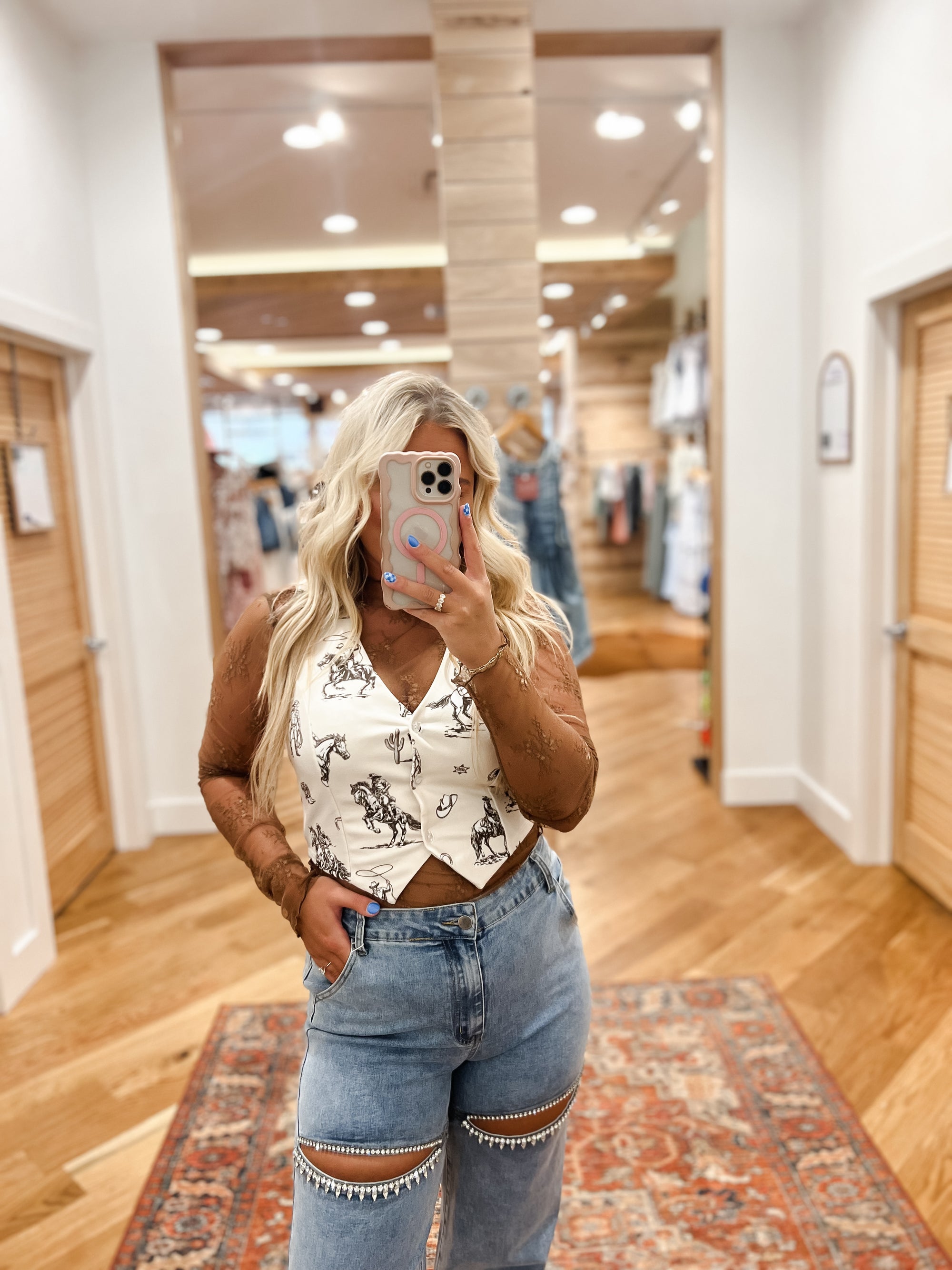 The Cowgirl Horse Vest features a stunning multi-horse design. Made with quality materials, this vest offers both comfort and style. Perfect for concerts and festivals. Boutique style Ashland, Kentucky 