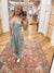 Expertly crafted from mineral washed cotton gauze, the Easy Days Sage Jumpsuit offers a sophisticated yet casual look. The sleeveless design and adjustable straps provide a comfortable fit, while the deep V-neck and elastic waist add a touch of elegance. With side pockets for added convenience, this jumpsuit is perfect for any easy day. Boutique Style Ashland, Kentucky 