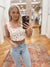Expertly designed, the Fiona Floral Off White top features a feminine scoop neckline and sleeveless design. With a front hook detail and cropped scallop hem, this corset top exudes elegance. Crafted from 100% polyester, this woven top is truly special. Boutique style Ashland, Kentucky 