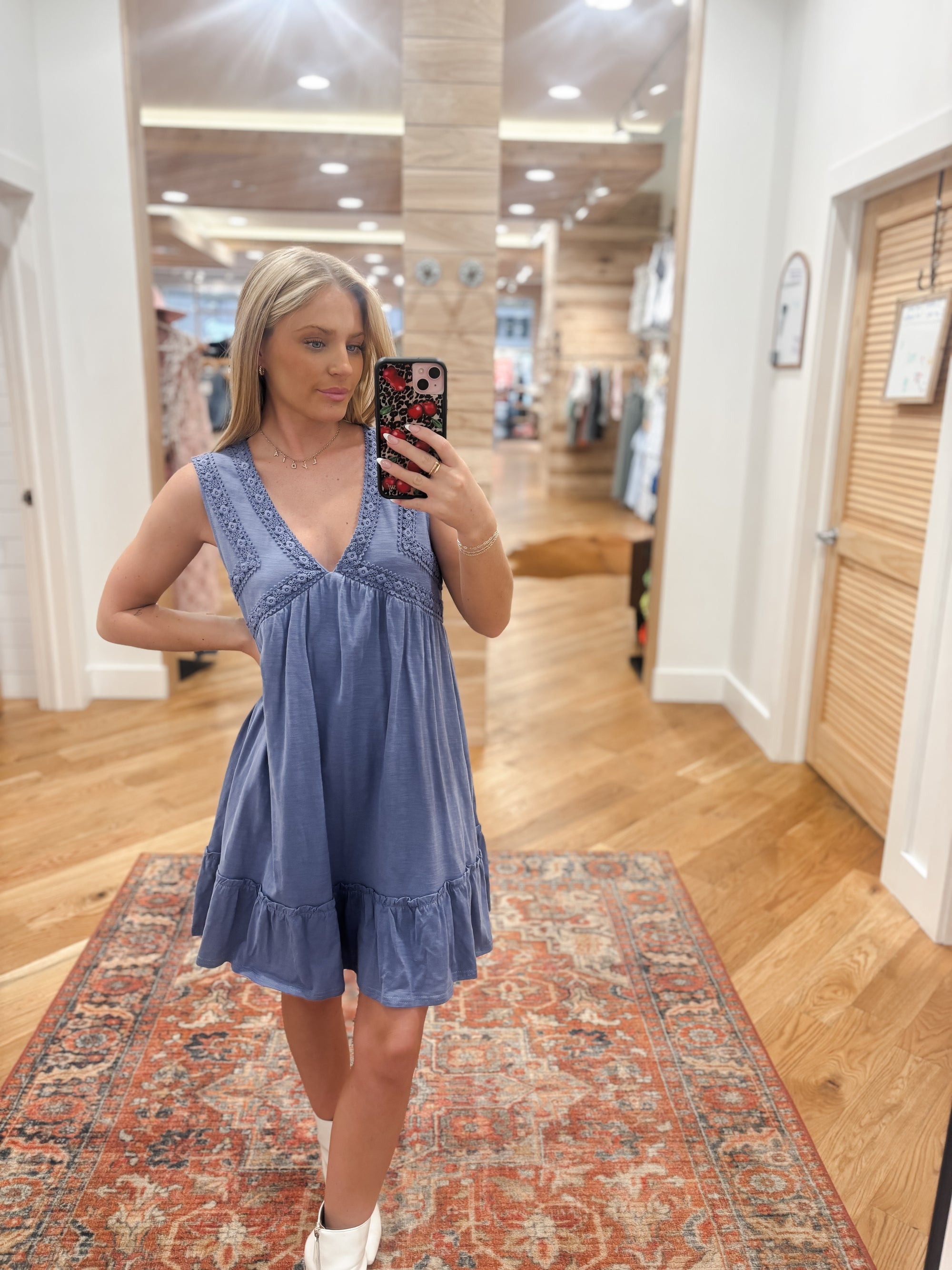 Made with a flattering v-neckline and feminine ruffle details, the Sweet Intentions Blue Dress is a must-have for any wardrobe. The shirring detail adds texture and dimension, while the vibrant blue trim brings a pop of color. Perfect for any occasion, this sleeveless mini dress is effortlessly stylish. Boutique style Ashland, Kentucky 