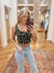Expertly designed, the Fiona Floral Black top features a feminine scoop neckline and sleeveless design. With a front hook detail and cropped scallop hem, this corset top exudes elegance. Crafted from 100% polyester, this woven top is truly special. Boutique style Ashland, Kentucky 