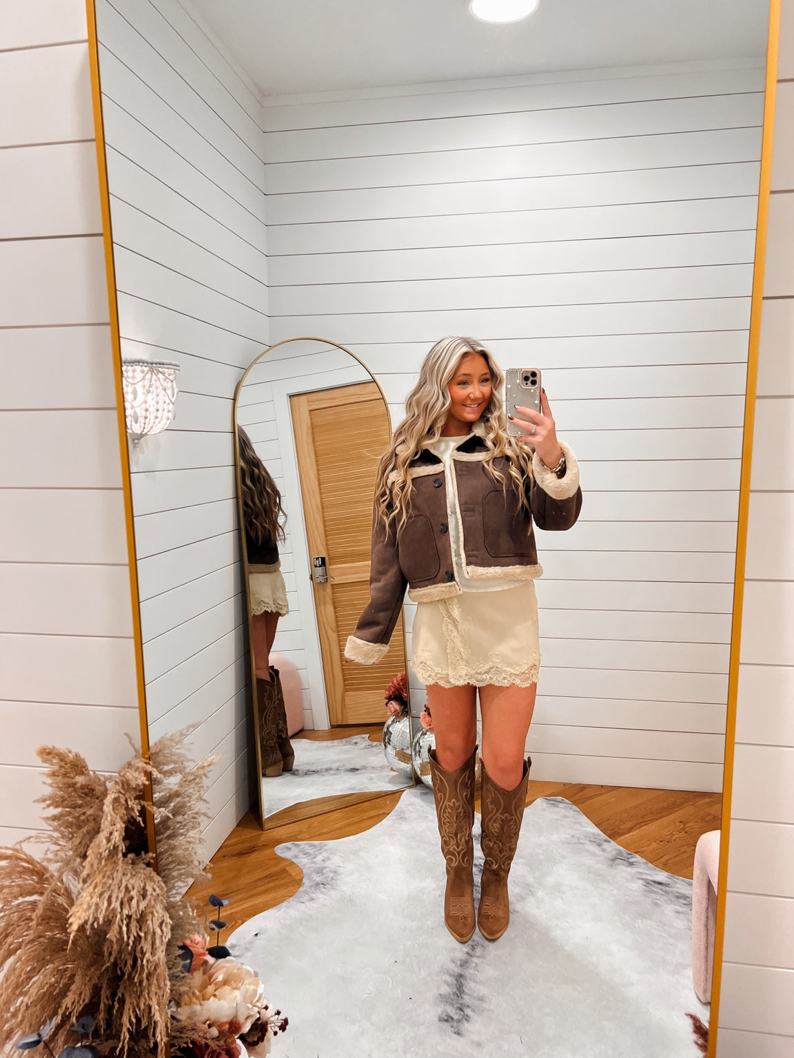 Brown Faux Suede Sherpa Jacket styled with a cream lace mini skirt